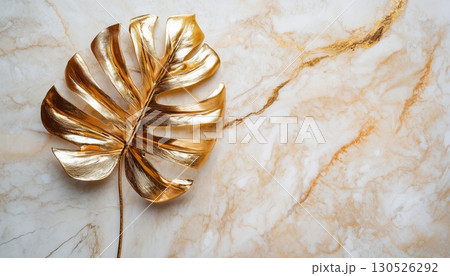 Luxurious Golden Monstera Leaf On Marble 130526292