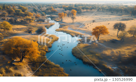 A drone uses AI tracking systems to monitor animals in a lush wildlife preserve. Great for conservation, research, and environmental themes. 130526990