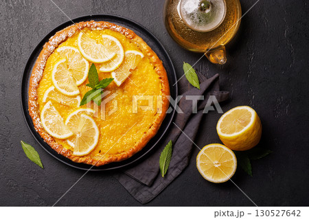 Delicious lemon tart with golden crust and smooth, glossy lemon filling 130527642