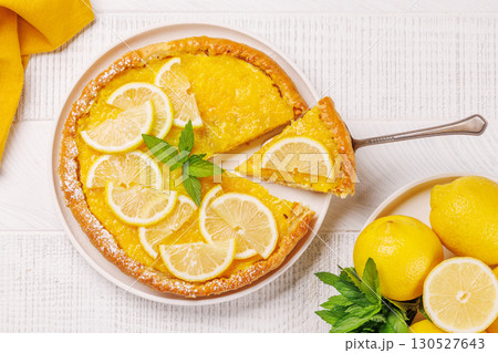 Delicious lemon tart with golden crust and smooth, glossy lemon filling 130527643