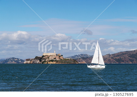 Scenic San Francisco landscape with Alcatraz Island and a yacht sailing in the bay 130527695