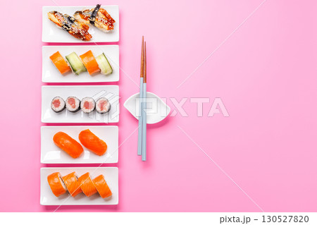 Assorted sushi and maki rolls beautifully arranged on plates Assorted sushi and maki rolls beautifully arranged on plates 130527820