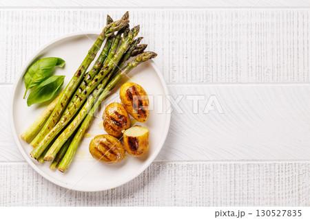 Grilled asparagus and golden baby potatoes 130527835