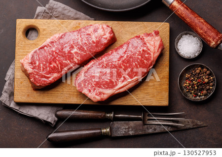 Raw marbled striploin steak, fresh, rich, ready for cooking 130527953