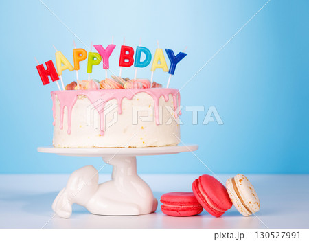 A festive birthday cake topped with colorful candles 130527991