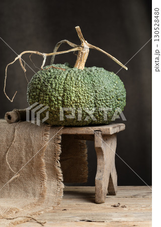Heirloom Winter Squash Buen Gusto de Horno On Wooden Stool Heirloom Winter Squash Buen Gusto de Horno On Wooden Stool 130528480
