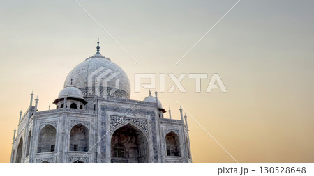 Taj Mahal in Agra, India. Majestic white marble structure with intricate carvings, ornate dome. Taj Mahal in Agra, India. Majestic white marble structure with intricate carvings, ornate dome. 130528648