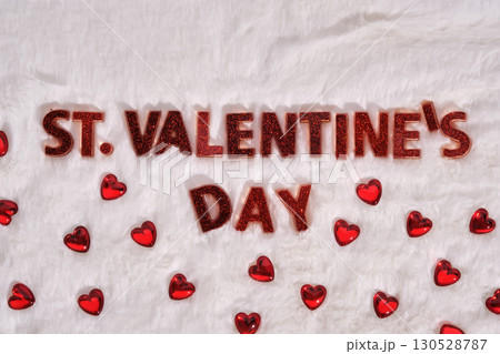 Festive St. Valentine's Day background on a white plush background with hearts. 130528787