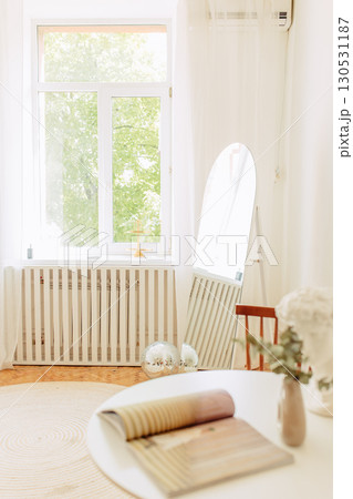 Interior of light living room with sofas, rattan table and soft carpet Interior of light living room with sofas, rattan table and soft carpet 130531187