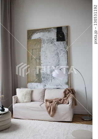 Interior of light living room with sofas, rattan table and soft carpet Interior of light living room with sofas, rattan table and soft carpet 130531192