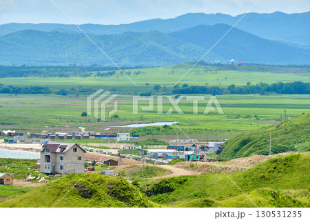 The nature of the Khasansky district of Primorsky Krai, Russia. The lip of the Teal of the Slavic Bay, the inner bay of Peter the Great in the summer. The nature of the Khasansky district of Primorsky Krai, Russia. The lip of the Teal of the Slavic Bay, the inner bay of Peter the Great in the summer. 130531235