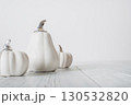 Minimalist White Pumpkins on White Wooden Background 130532820