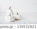 Minimalist White Pumpkins on White Wooden Background 130532821