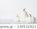 Minimalist White Pumpkins on White Wooden Background 130532823