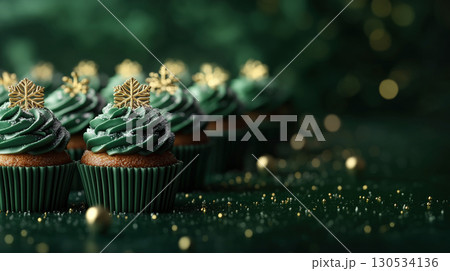 Cupcakes group smooth frosting green pattern light snowflake golden pastel colors, Christmas background Cupcakes group smooth frosting green pattern light snowflake golden pastel colors, Christmas background 130534136