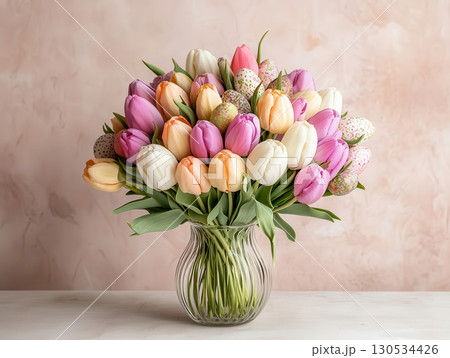 Colorful tulips in glass vase on pink background with minimal style, frame, place for text 130534426
