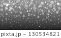 Shiny snowflakes with glowing bokeh light fall on a transparent background. Seasonal vector overlay for Christmas, New Year, posters, invitations, and magic holiday mood. 130534821