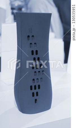 Object printed on 3D printer from molten plastic powder close-up. Model of blue color printed on 3D printer from melted polyamide powder. Modern additive 3D printing technology. Multi Jet Fusion MJF 130535951