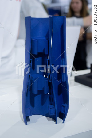 Object printed on 3D printer from molten plastic powder close-up. Model of blue color printed on 3D printer from melted polyamide powder. Modern additive 3D printing technology. Multi Jet Fusion MJF 130535952