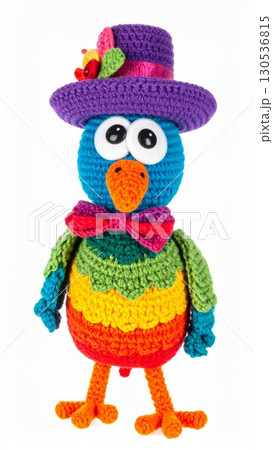 Colorful Knitted Bird Toy with Hat and Bow Tie on White Seamless Background Colorful Knitted Bird Toy with Hat and Bow Tie on White Seamless Background 130536815