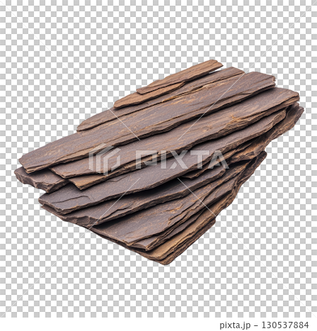 A stack of layered, flat, brown slate stones is arranged neatly, showcasing their natural texture and earthy tones. These stones are often used landscaping and construction for their durability 130537884