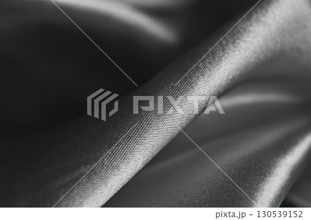 Detailed texture of a soft gray fabric folded elegantly 130539152