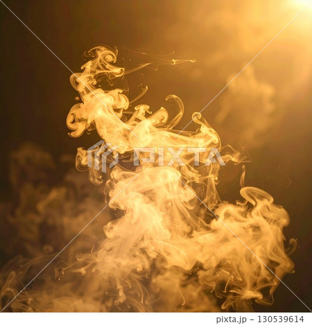 Swirling Golden Smoke Trails Against a Dark Backdrop Creates a Dreamy Abstract Effect 130539614