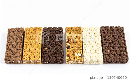 Assorted Cereal and Granola Bars with Chocolate and Nuts on White Background 130540630