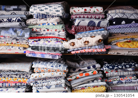 heap of colorful cloth on shelf for sale in store heap of colorful cloth on shelf for sale in store 130541054