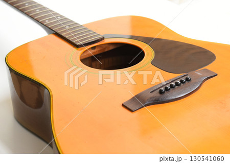 brown wood acoustic guitar isolated on white background 130541060