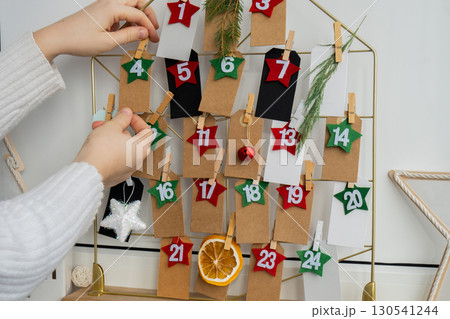 Traditional twenty four days advent calendar before Christmas holidays. Plastic free zero waste sustainable decoration. Winter cozy home Catholic traditions of Christmas countdown new year 130541244