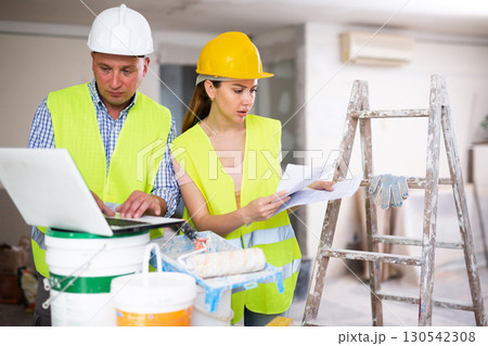 Construction workers working at house being renovated 130542308