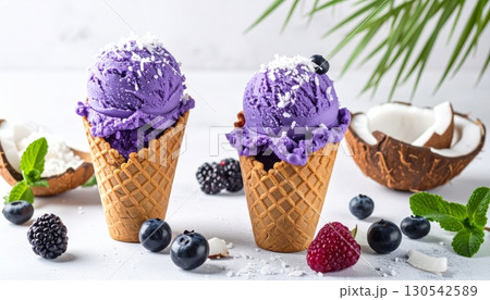 Cold ice cream dessert with fresh summer fruits and berries in a glass 130542589