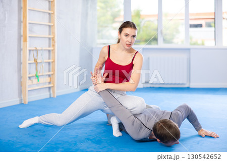 Woman and man practicing self defense techniques 130542652
