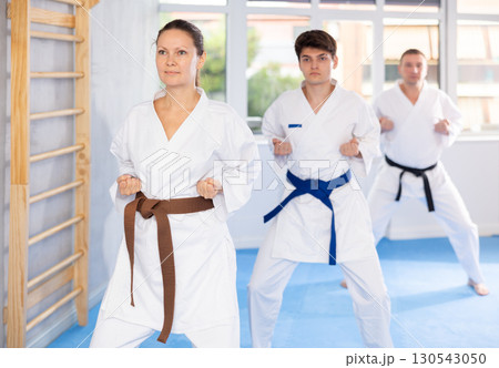 Athletes have starting position and repeating sequence of punches and painful techniques in kata Athletes have starting position and repeating sequence of punches and painful techniques in kata 130543050