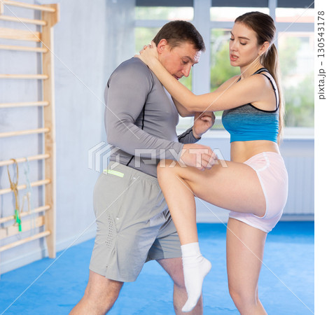Woman and man practicing self defense techniques Woman and man practicing self defense techniques 130543178