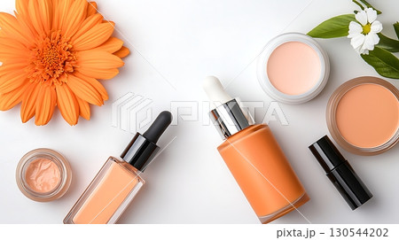 Vibrant Orange Beauty Products with Floral Accent for Skincare and Makeup Photography Vibrant Orange Beauty Products with Floral Accent for Skincare and Makeup Photography 130544202
