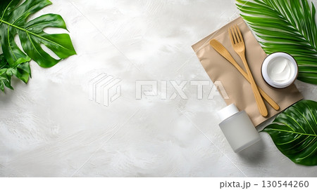 Natural Organic Wellness Products on a Minimalist Background with Tropical Leaves 130544260