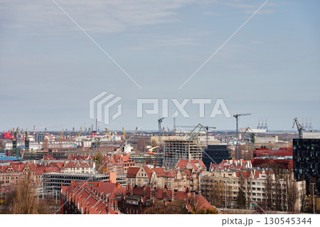 Panoramic view of Gdansk city with port cranes 130545344
