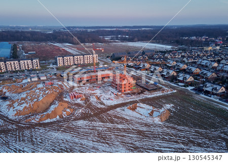 Construction site with cranes and new buildings 130545347