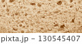 Bread slice macro texture, baked dough pattern. White bread loaf cut close up, wheat toast slice 130545407