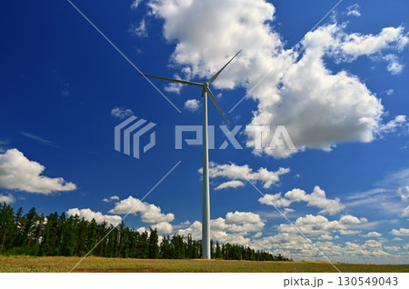 Wind power plant on meadow. Concept for energy, technology and green power with clean environment. Wind power plant on meadow. Concept for energy, technology and green power with clean environment. 130549043