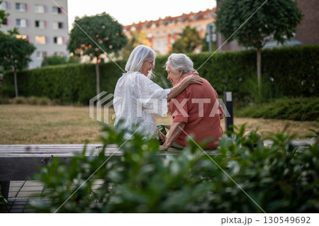 Tender moment between elderly mother and adult daughter. Tender moment between elderly mother and adult daughter. 130549692