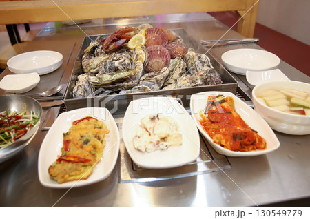 Korean Seafood Food. Steamed oysters and scallops 130549779