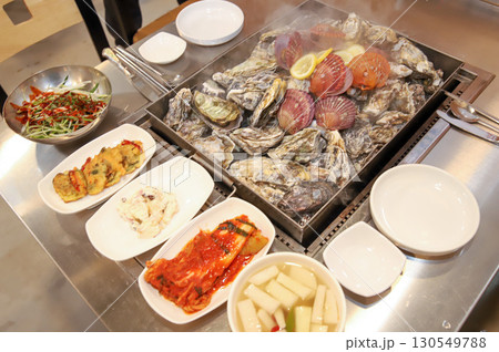 Korean Seafood Food. Steamed oysters and scallops Korean Seafood Food. Steamed oysters and scallops 130549788