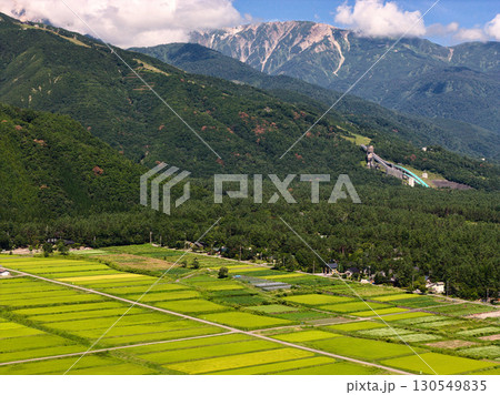 飯森地区の広大な水田とジャンプ台　長野県白馬村（ドローンによる空撮） 130549835