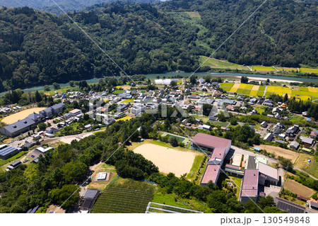 生坂小学校上空から見る生坂の街並み 長野県生坂村(ドローンによる空撮) 生坂小学校上空から見る生坂の街並み 長野県生坂村(ドローンによる空撮) 130549848