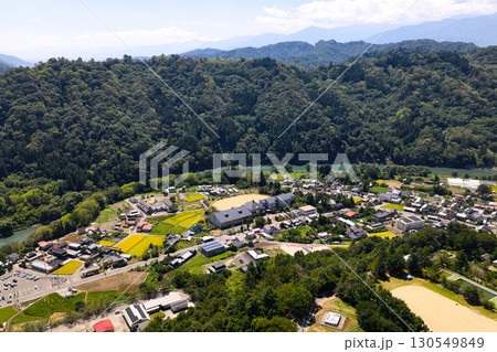 生坂小学校上空から見る生坂の街並み 長野県生坂村(ドローンによる空撮) 生坂小学校上空から見る生坂の街並み 長野県生坂村(ドローンによる空撮) 130549849