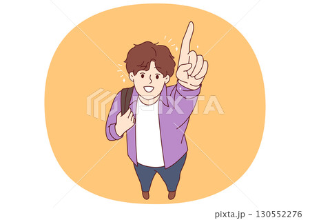Happy college student pointing finger up and smiling, holding backpack on shoulder 130552276