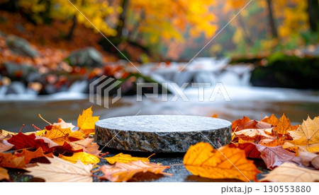 Stone Podium by the Stream with Autumn Leaves Stone Podium by the Stream with Autumn Leaves 130553880